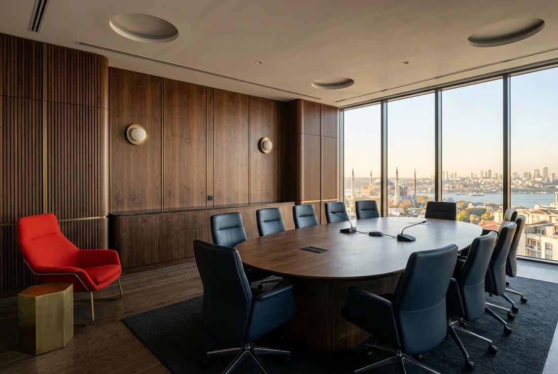 Executive space law and aerospace policy conference suite with vertical acoustic timber slats, elliptical table, Hagia Sophia view and a red armchair