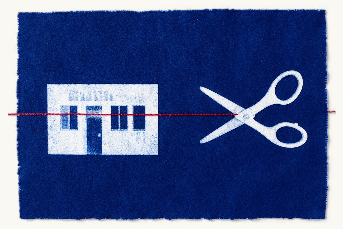Closing a company in Türkiye: a low office block with a red thread running from its door to large open scissors that have cut it, the two ends lying apart, cyanotype print
