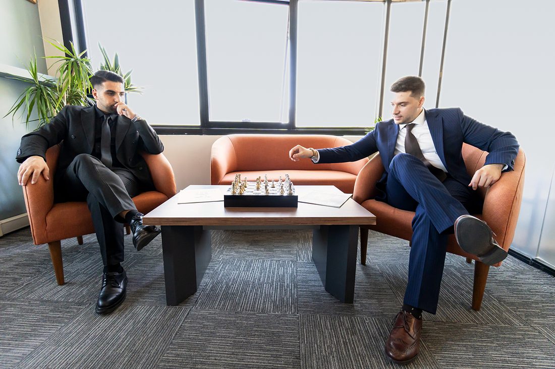Founding partners Oruç Aygün (left) and Onur Çalışıcı (right) at a chess table in the lounge of the Lexin Legal office in Istanbul